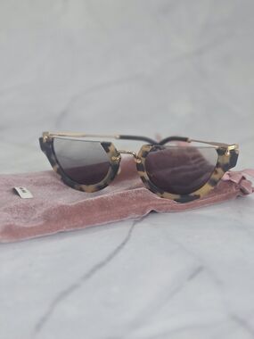 Miu Miu Tortoiseshell Cat-Eye Sunglasses with Gold Accents and Brown Lenses
